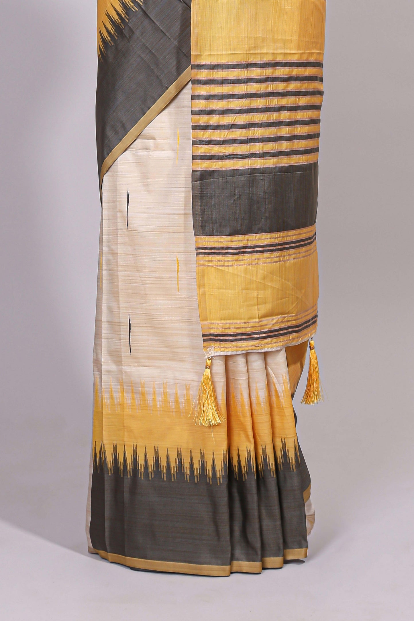 Off white ikkat design semi tussar saree with contrast dual shade border and matching striped blouse