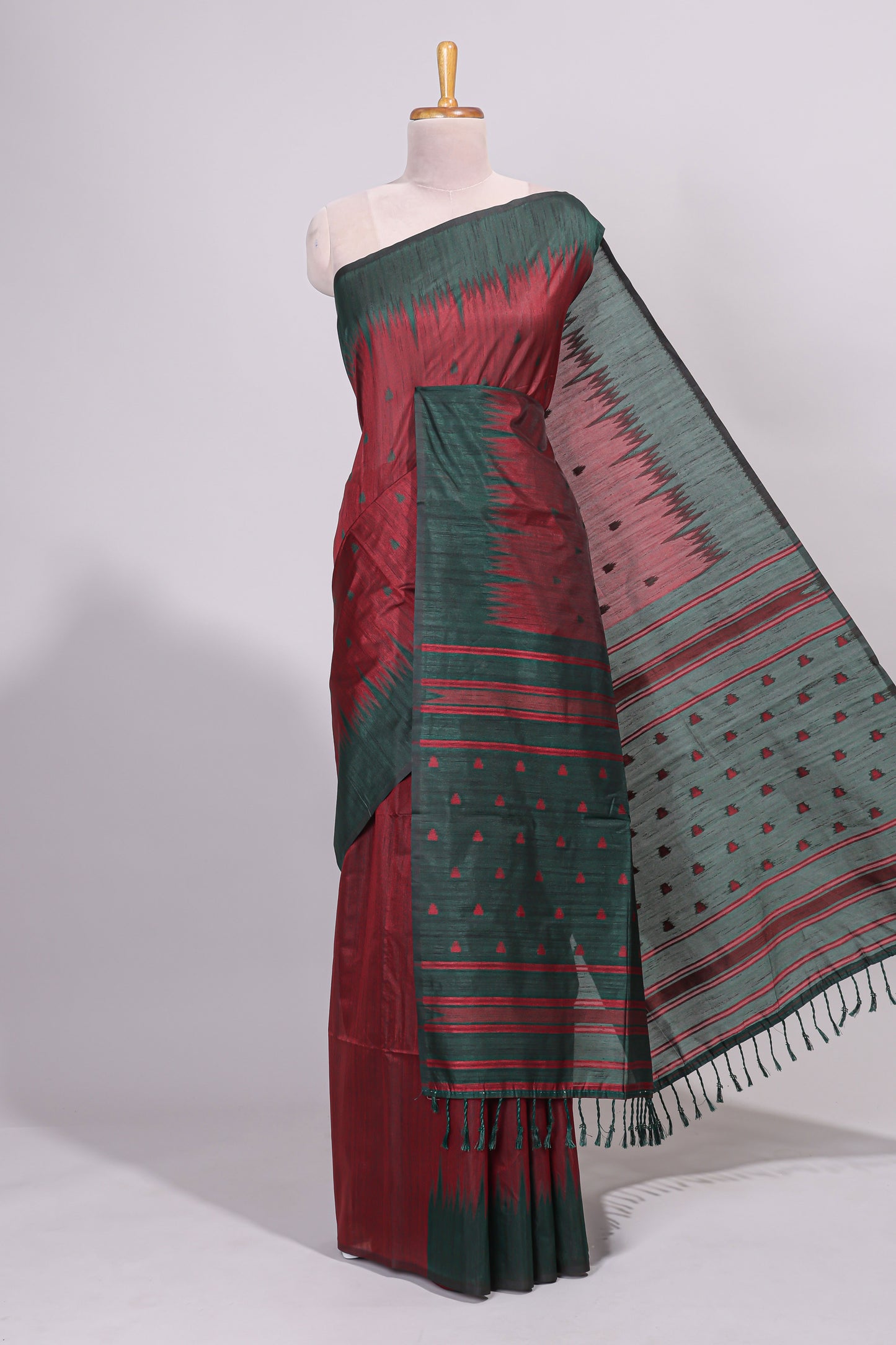Maroon ikkat motifs design semi tussar saree with contrast border and striped blouse