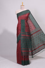 Maroon ikkat motifs design semi tussar saree with contrast border and striped blouse