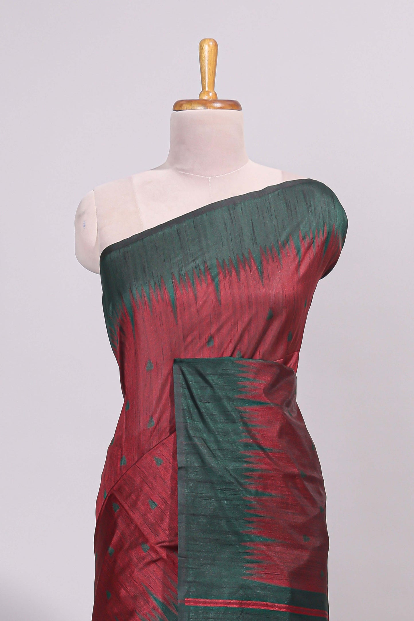 Maroon ikkat motifs design semi tussar saree with contrast border and striped blouse