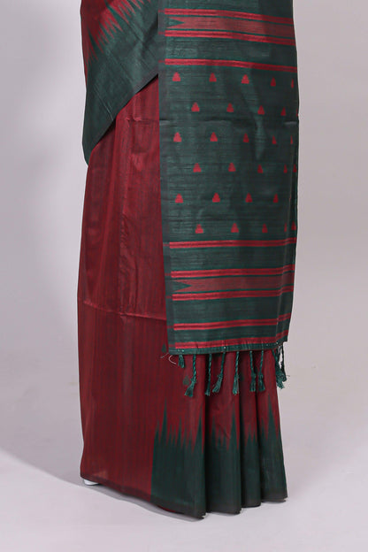 Maroon ikkat motifs design semi tussar saree with contrast border and striped blouse