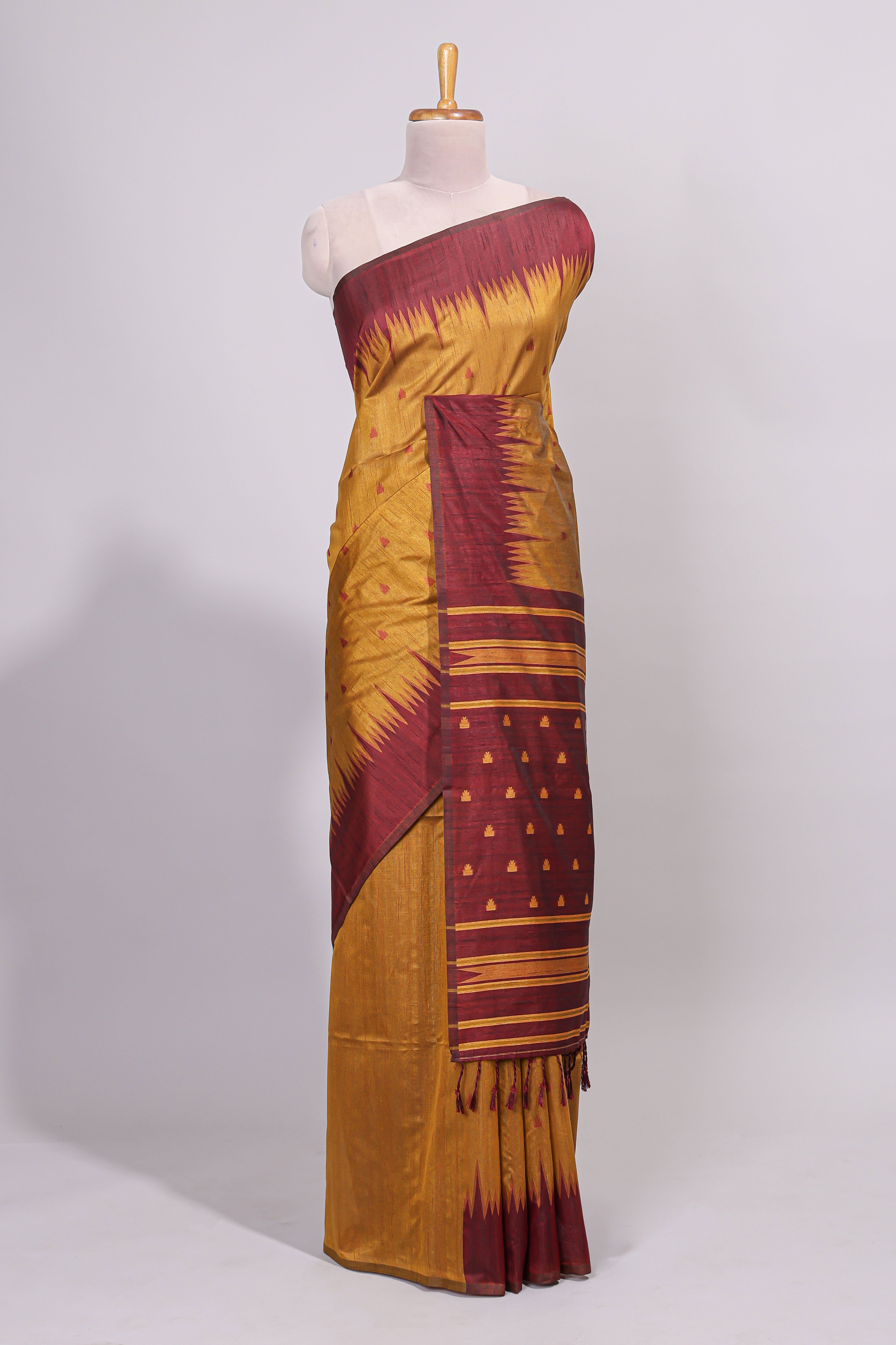 Mustard ikkat motifs design semi tussar saree with contrast border and striped blouse