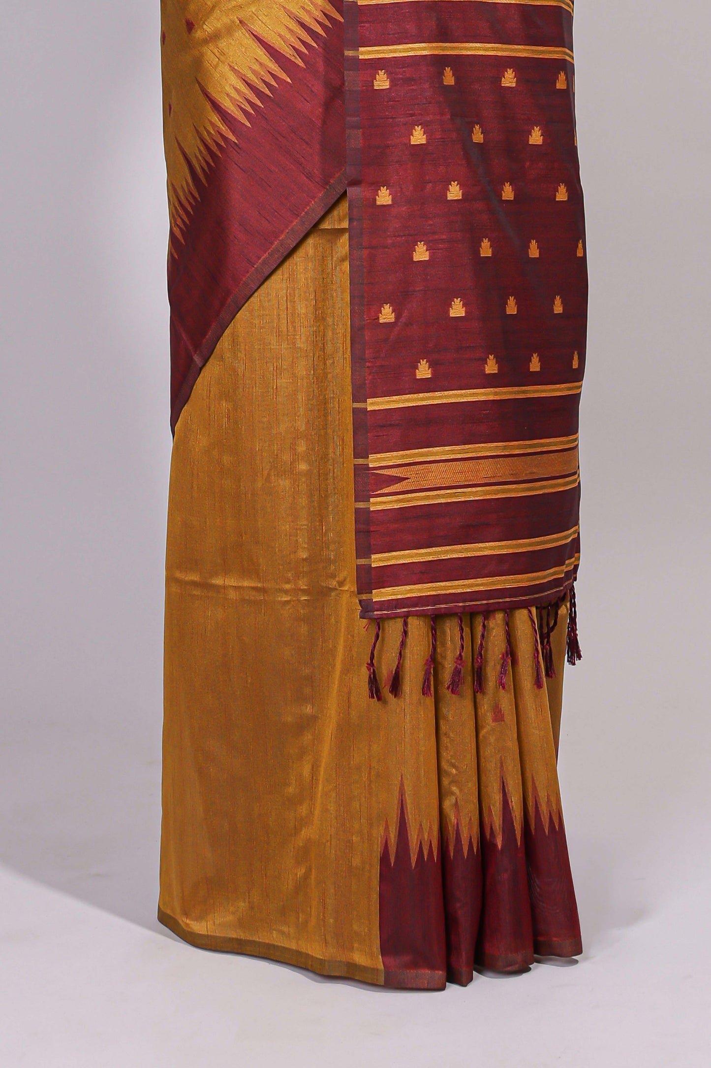 Mustard ikkat motifs design semi tussar saree with contrast border and striped blouse