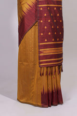 Mustard ikkat motifs design semi tussar saree with contrast border and striped blouse