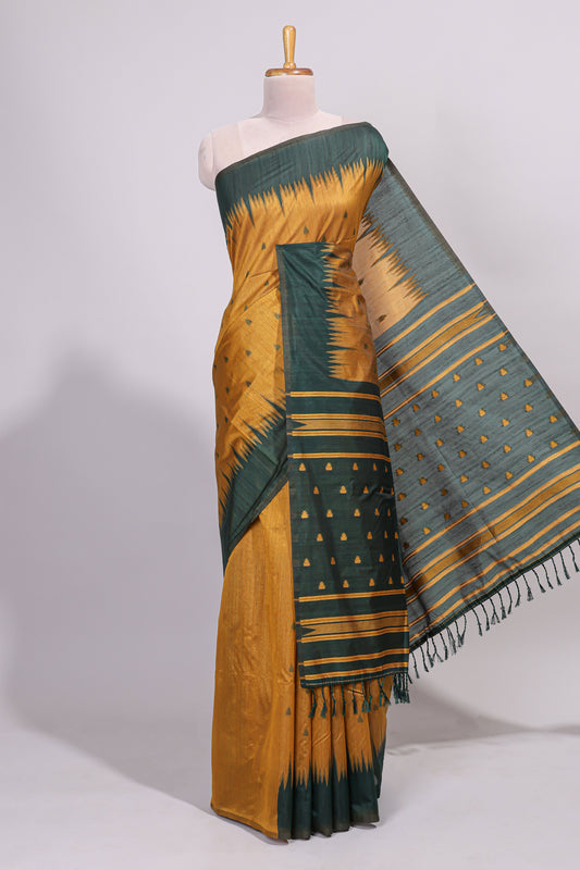 Mustard ikkat motifs design semi tussar saree with contrast green border and striped blouse