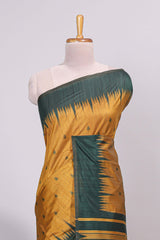Mustard ikkat motifs design semi tussar saree with contrast green border and striped blouse