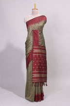 Green ikkat motifs design semi tussar saree with contrast green border and striped blouse