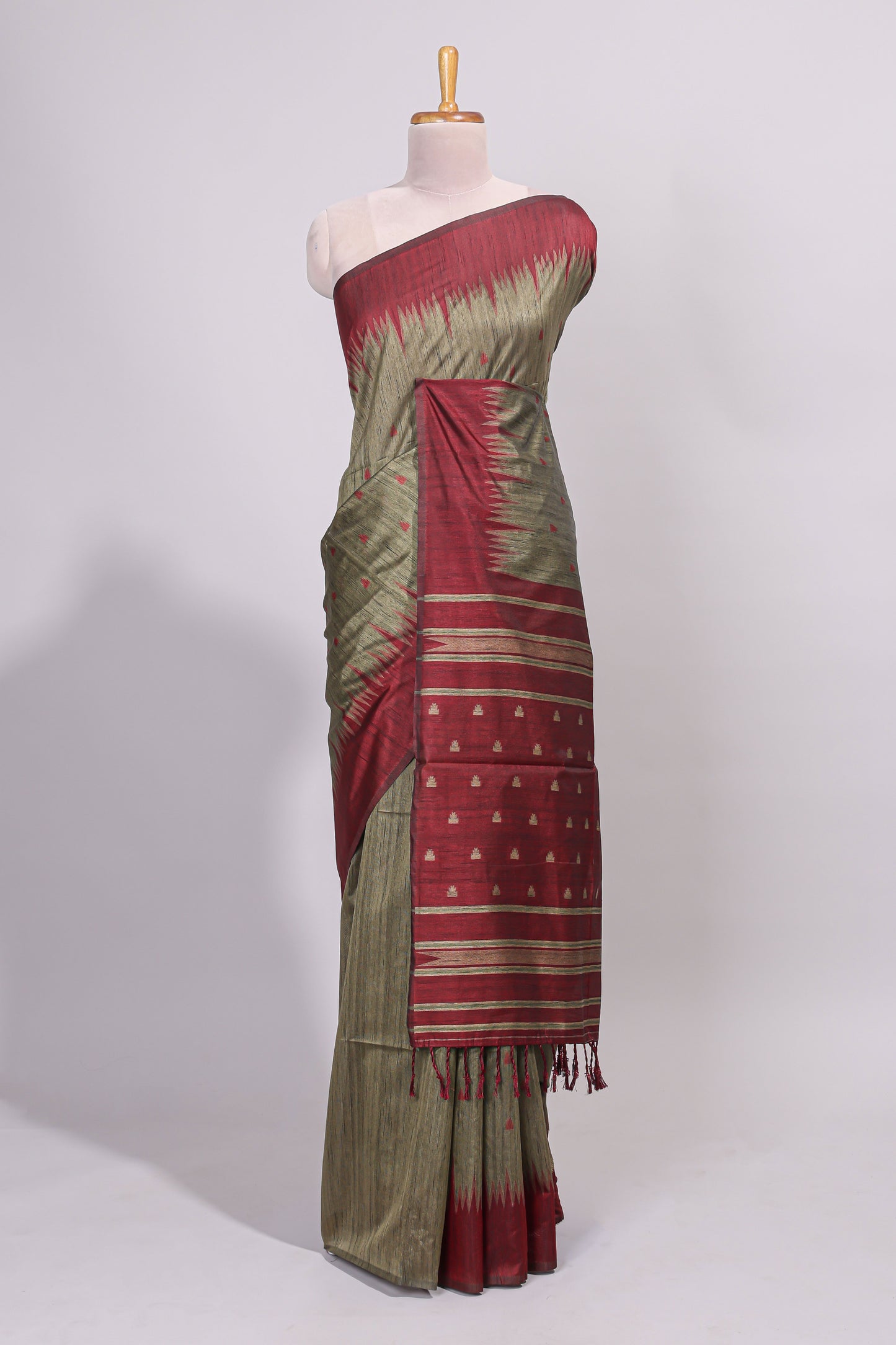 Green ikkat motifs design semi tussar saree with contrast green border and striped blouse