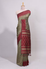 Green ikkat motifs design semi tussar saree with contrast green border and striped blouse