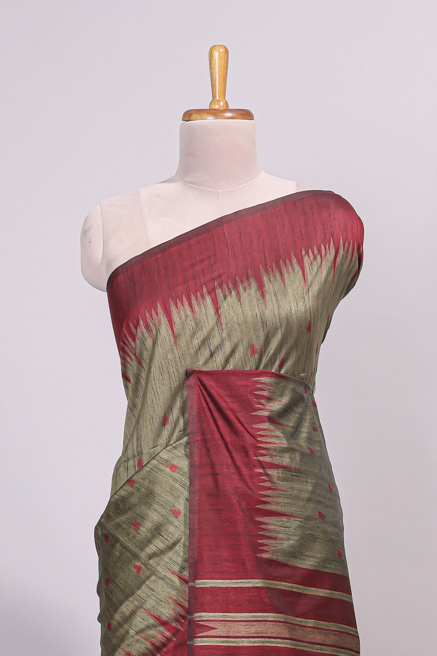 Green ikkat motifs design semi tussar saree with contrast green border and striped blouse