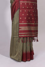 Green ikkat motifs design semi tussar saree with contrast green border and striped blouse