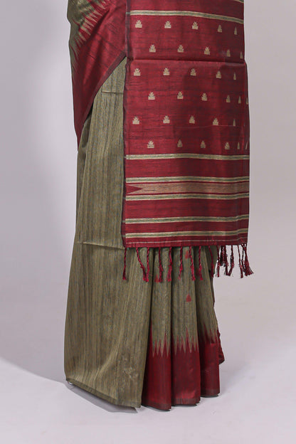 Green ikkat motifs design semi tussar saree with contrast green border and striped blouse