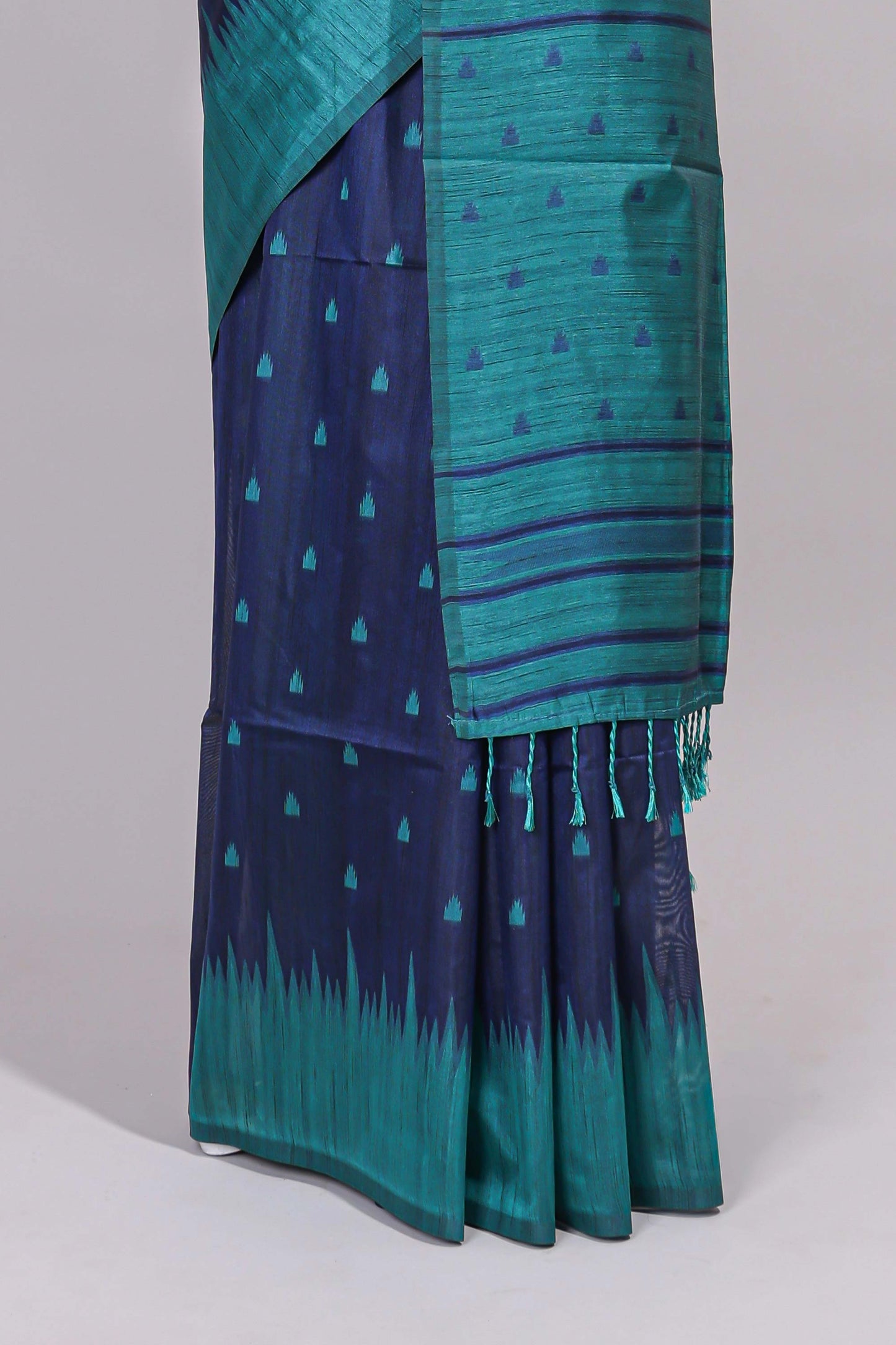 Blue ikkat motifs design semi tussar saree with contrast border and striped blouse