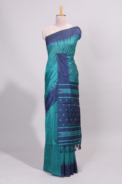 Green ikkat motifs design semi tussar saree with contrast border and striped blouse