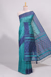 Green ikkat motifs design semi tussar saree with contrast border and striped blouse