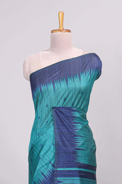 Green ikkat motifs design semi tussar saree with contrast border and striped blouse
