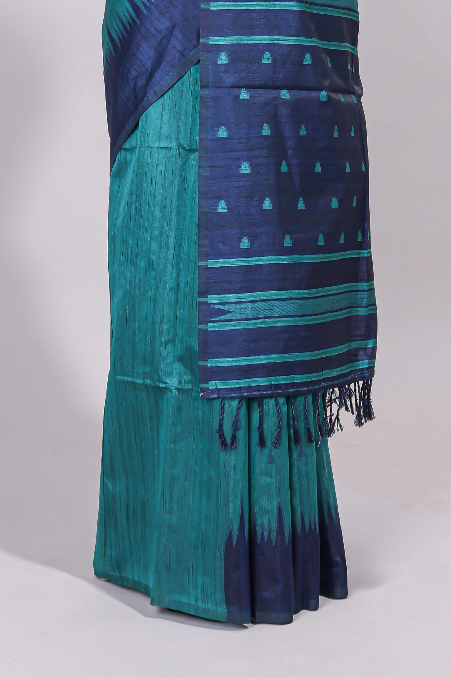Green ikkat motifs design semi tussar saree with contrast border and striped blouse
