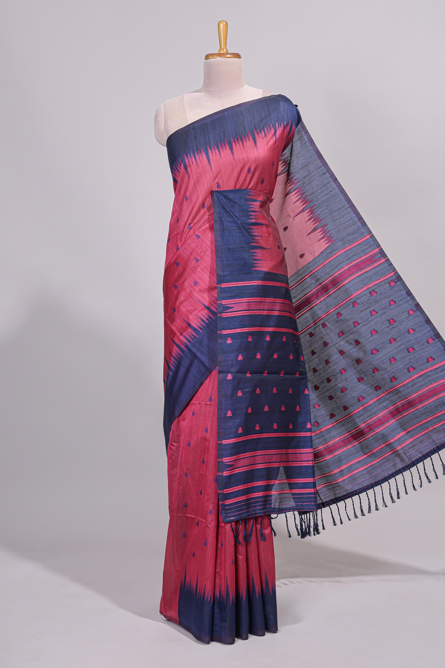Pink ikkat motifs design semi tussar saree with contrast border and striped blouse