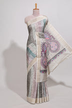 Pastel green colour kalamakri art  tussar saree  with floral creeper prints zari border and kalamkari peacock motif print pallu