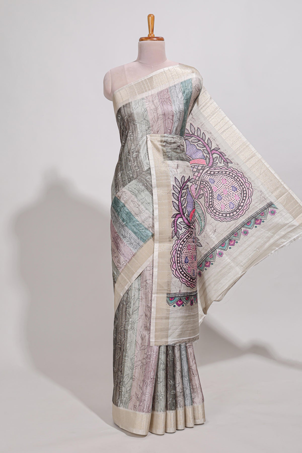 Pastel green colour kalamakri art  tussar saree  with floral creeper prints zari border and kalamkari peacock motif print pallu
