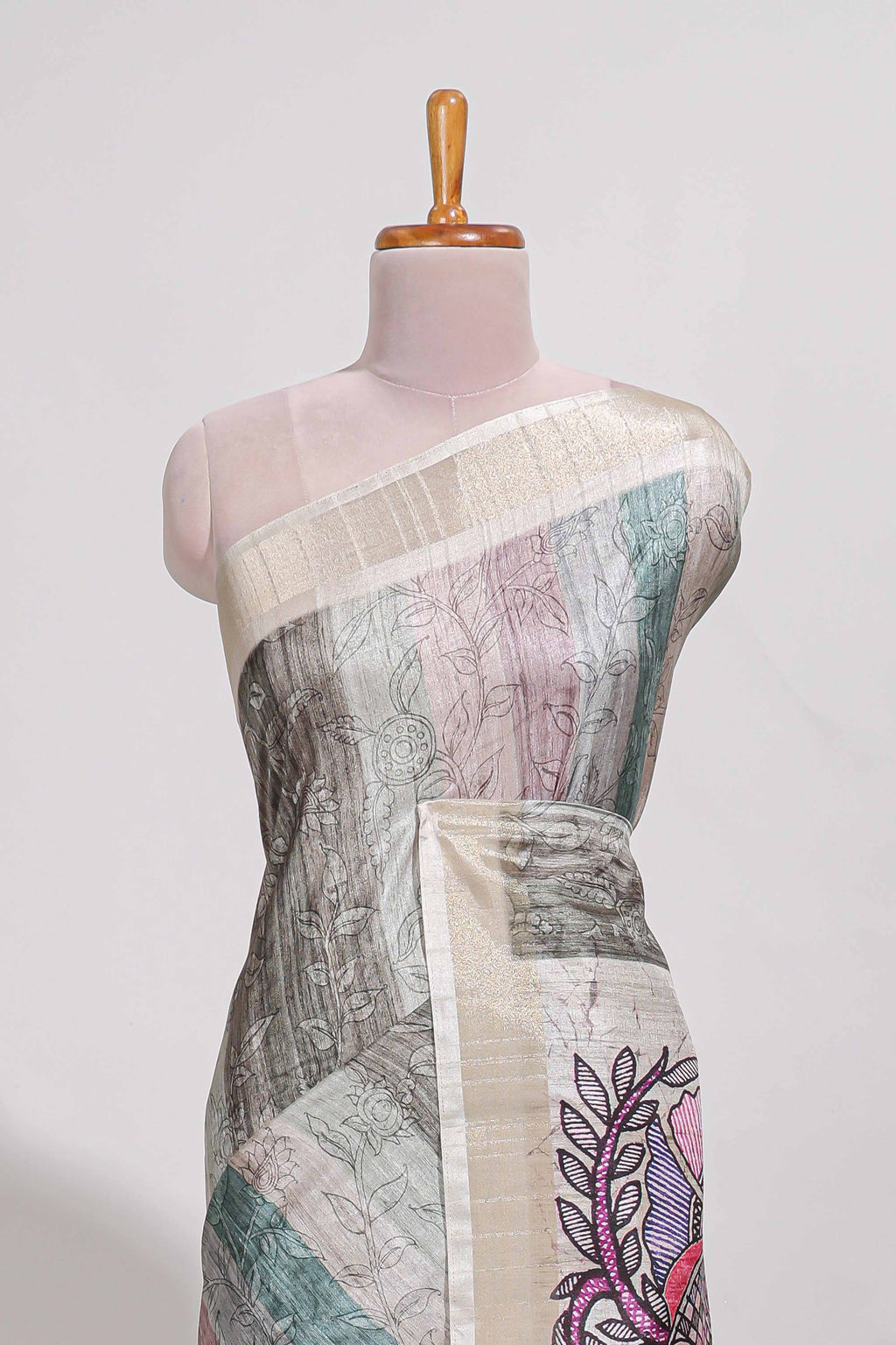 Pastel green colour kalamakri art  tussar saree  with floral creeper prints zari border and kalamkari peacock motif print pallu