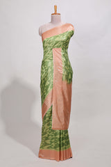 green colour ikkatdesignsemi tussar saree with contrast border andblouse