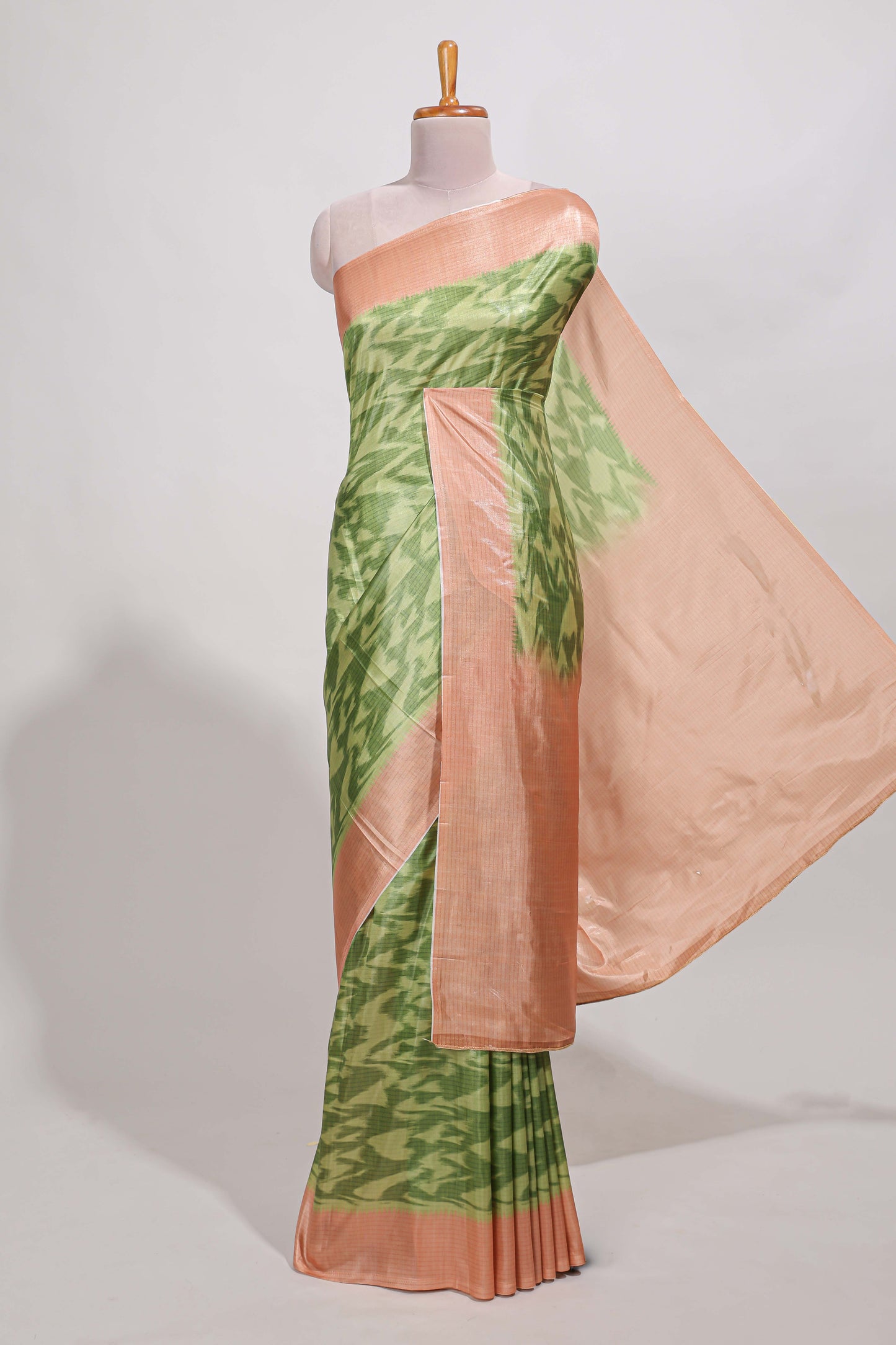 green colour ikkat  design  semi tussar saree with contrast border and  blouse
