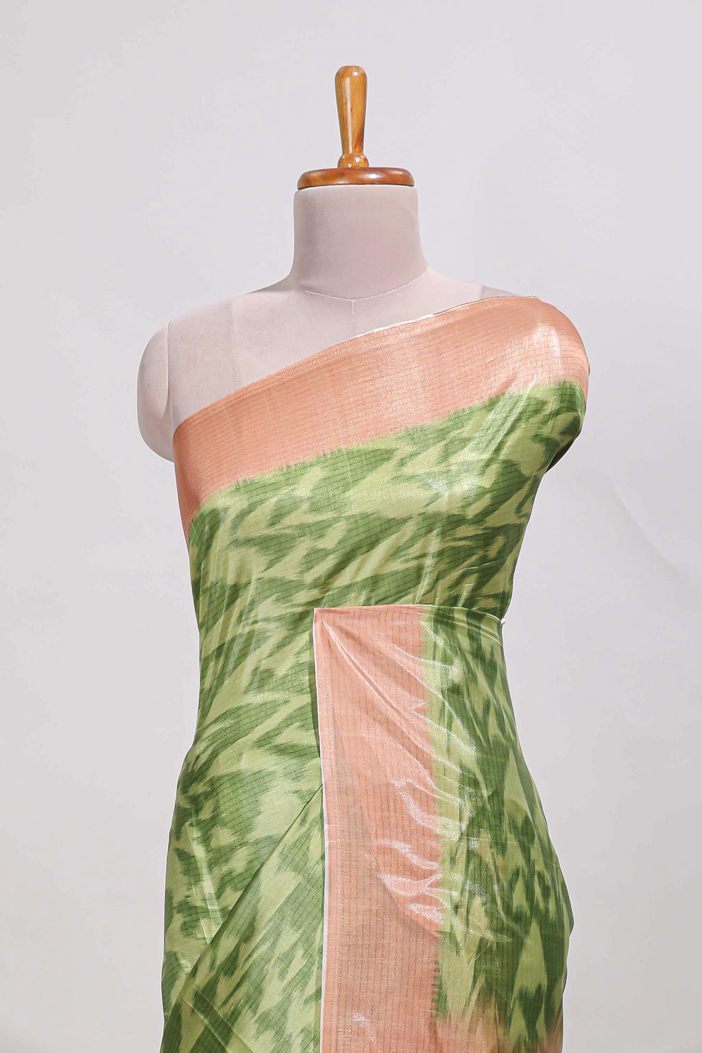 green colour ikkat  design  semi tussar saree with contrast border and  blouse