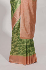 green colour ikkatdesignsemi tussar saree with contrast border andblouse