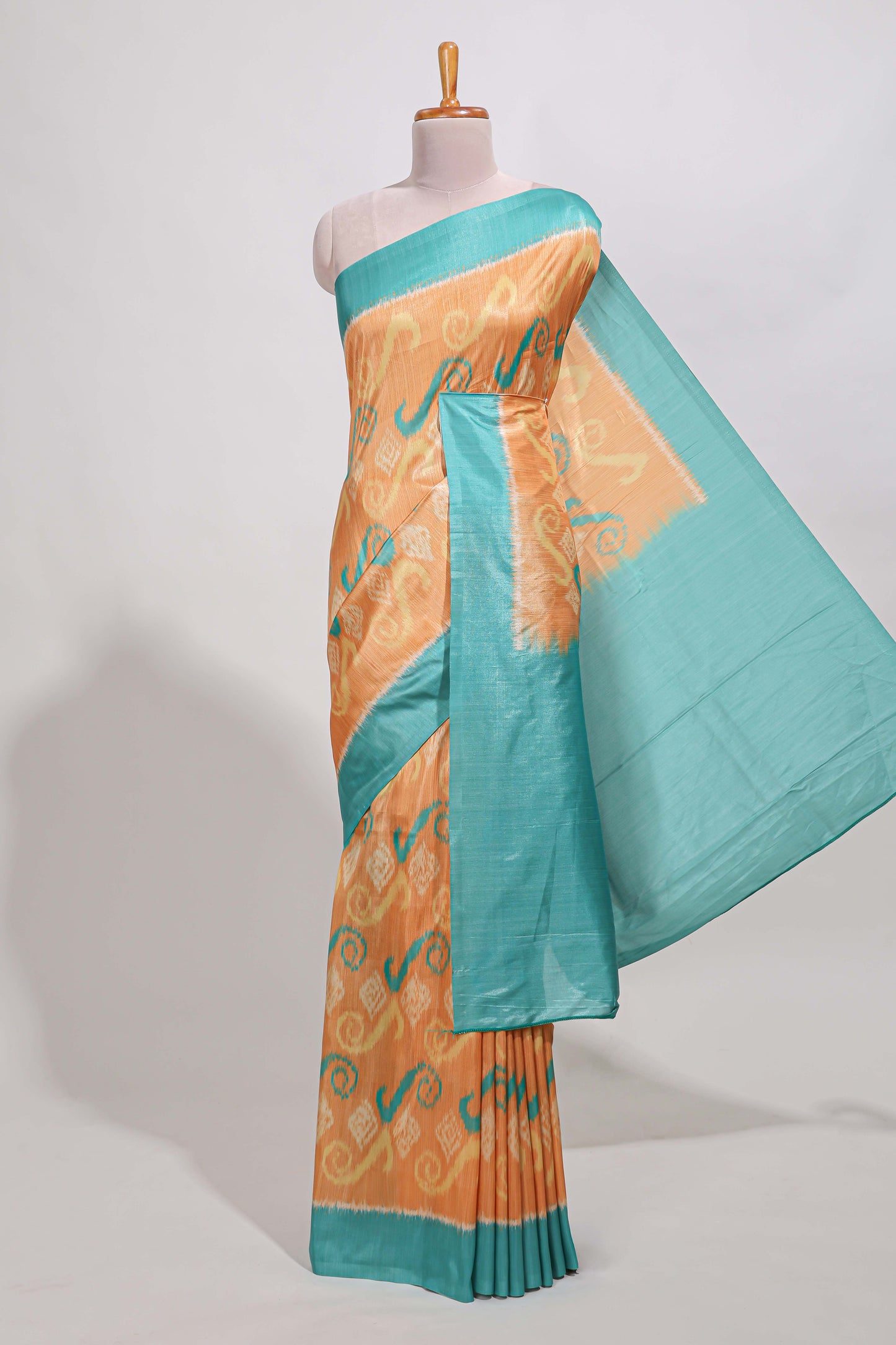 orange colour and ikkat printed design  semi tussar saree with contrast border and  contrast blouse (Copy)