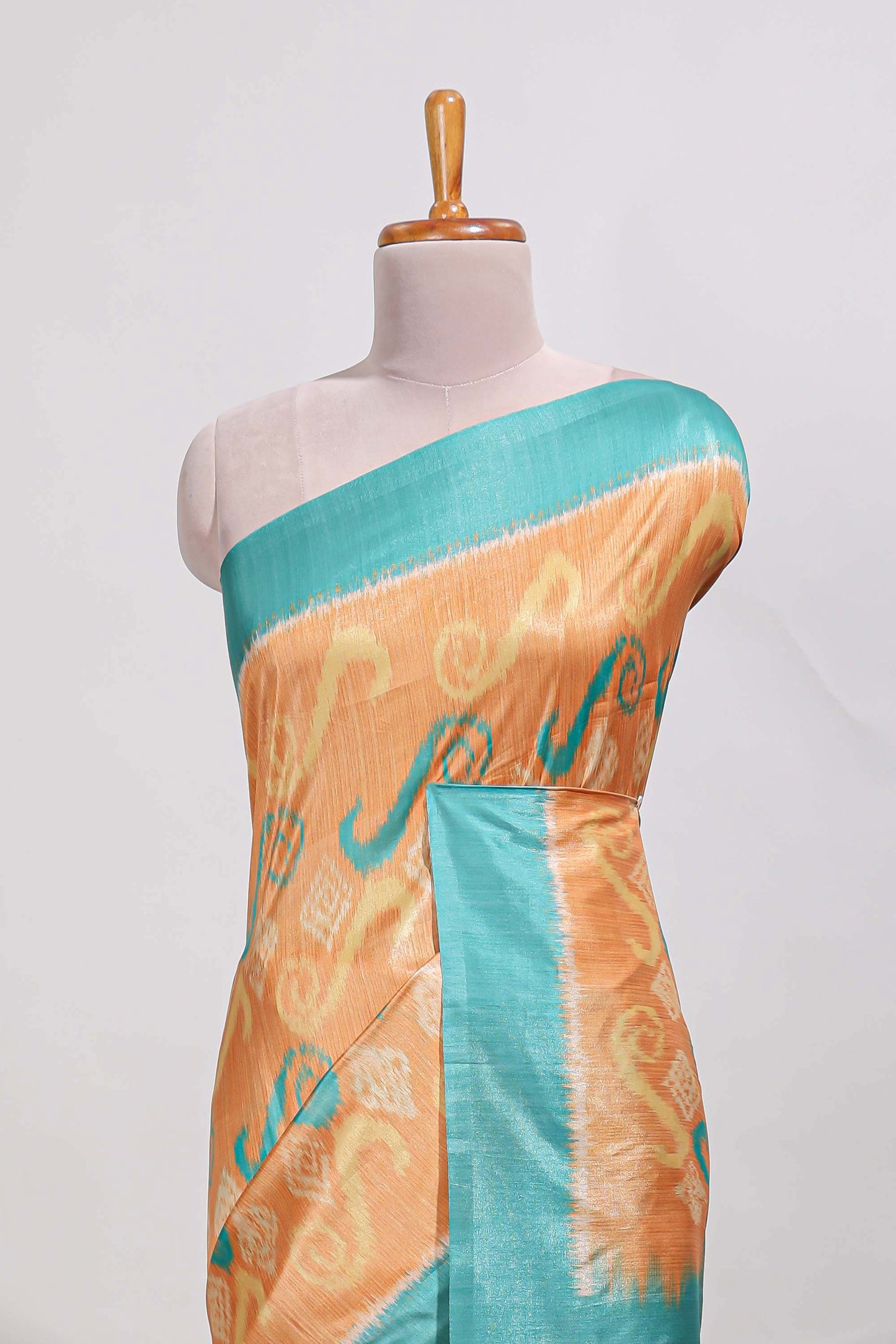 orange colour and ikkat printed design  semi tussar saree with contrast border and  contrast blouse (Copy)