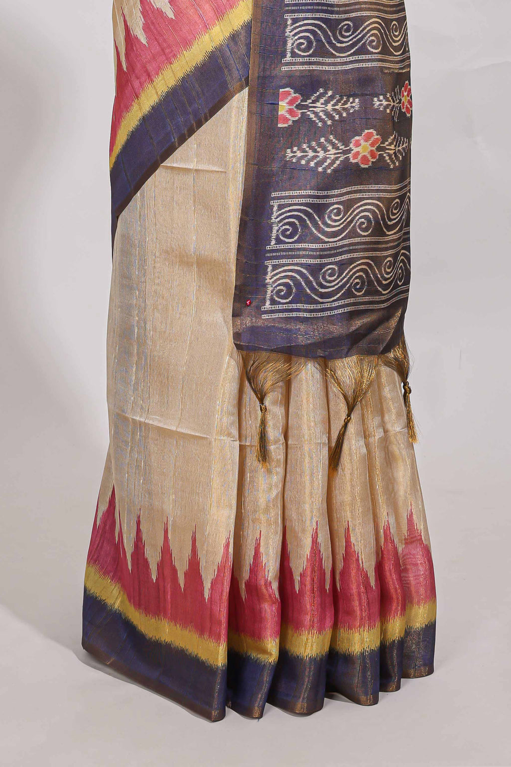 Beige colour semi tussar saree with temple border and tissue blouse