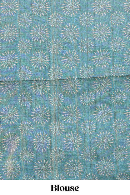 Teal green warli print tussar saree with self print blouse , along with tassels