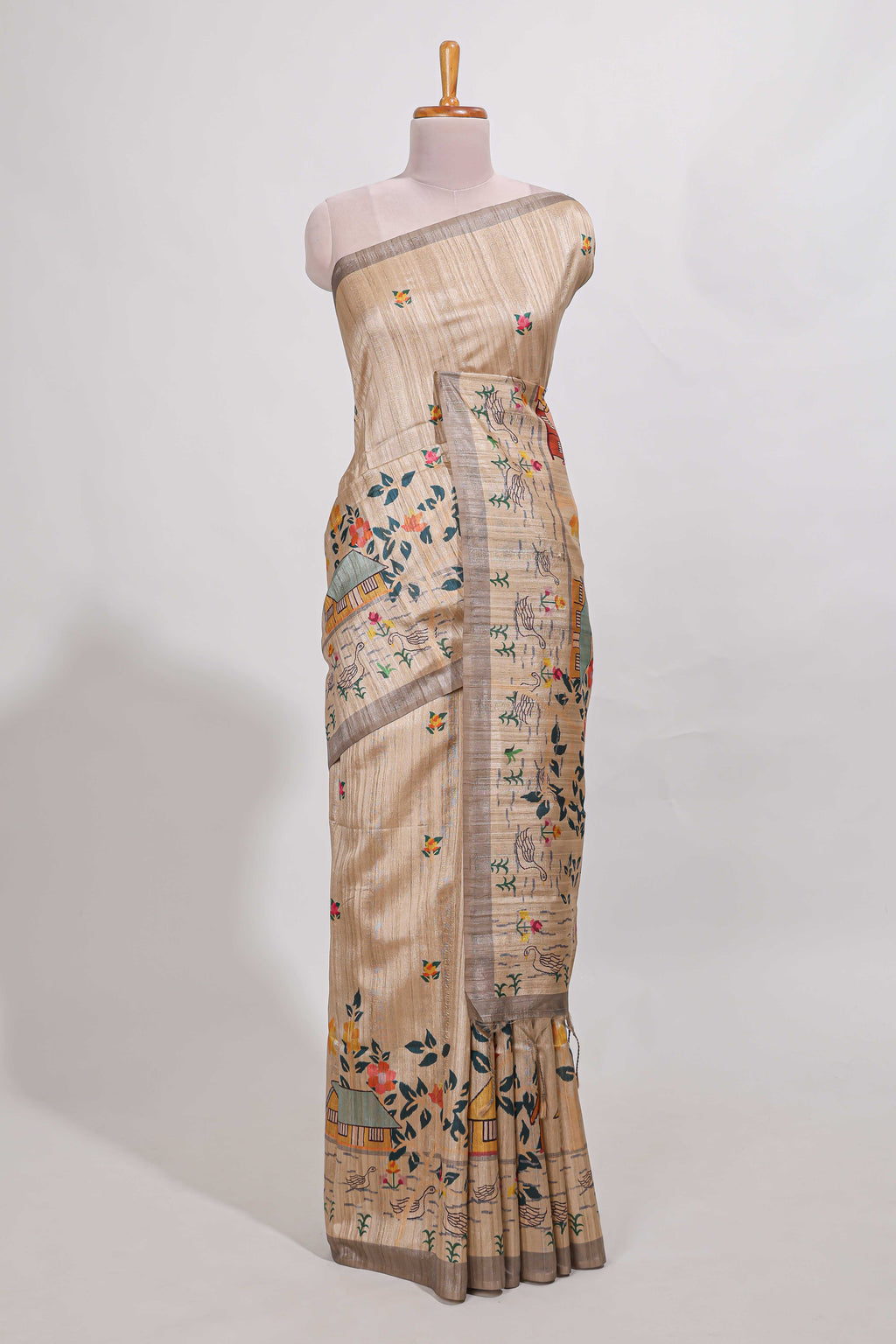 Beige colour artistic village art tussar saree with small border and matching pallu
