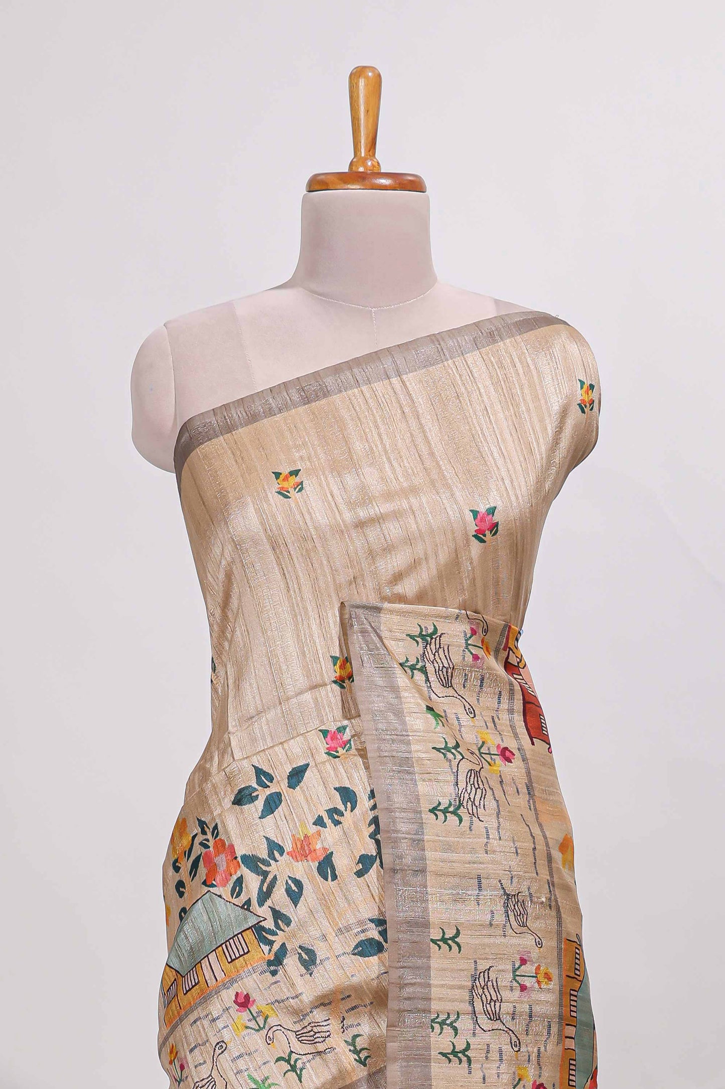 Beige colour artistic village art tussar saree with small border and matching pallu