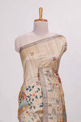 Beige colour artistic village art tussar saree with small border and matching pallu