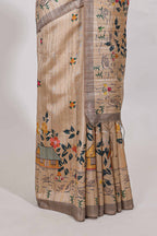 Beige colour artistic village art tussar saree with small border and matching pallu