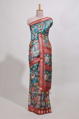 Turkish blue kalamkari style tussar saree with small zari border and print pallu with floral print blouse
