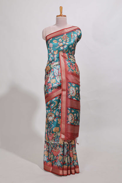Green kalamkari style tussar saree with small zari border and print pallu with floral print blouse