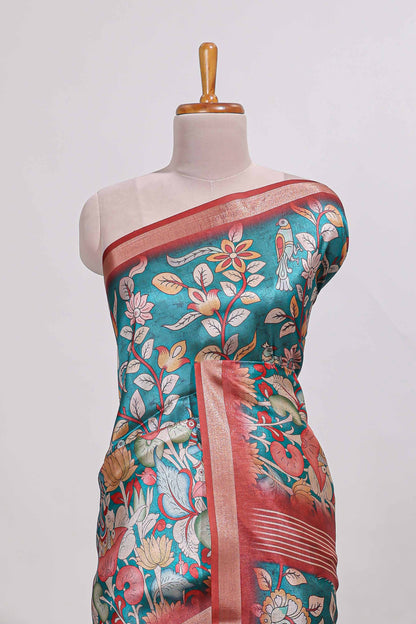 Green kalamkari style tussar saree with small zari border and print pallu with floral print blouse