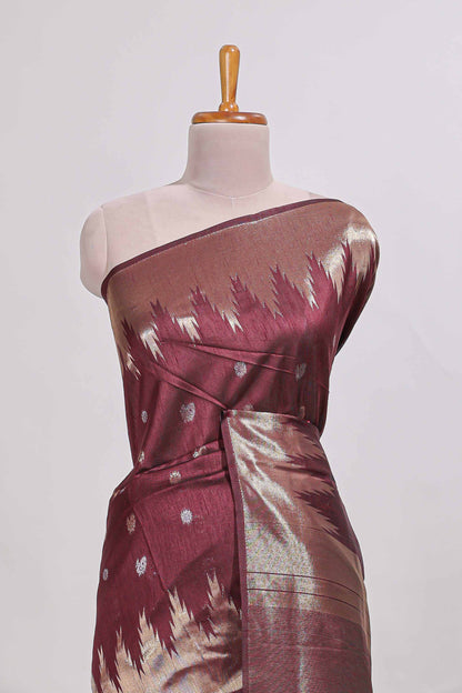 Maroon shimmering zari tussar saree with zari detailing temple pattern borders , and a rich zari pallu