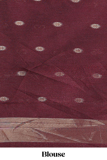 Maroon shimmering zari tussar saree with zari detailing temple pattern borders , and a rich zari pallu