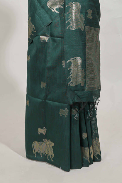 green tussar saree elephant inspired zari motifs  with  zari butta blouse and matching pallu