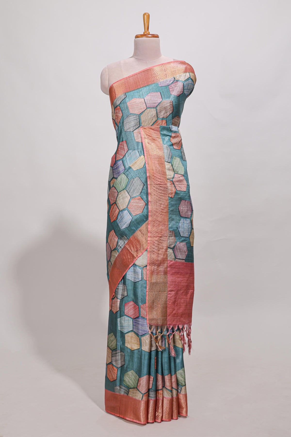Sea green geometrical tussar silk saree multi coloured honeycomb geomatric  patterns ,  rich matching pallu along with tussles