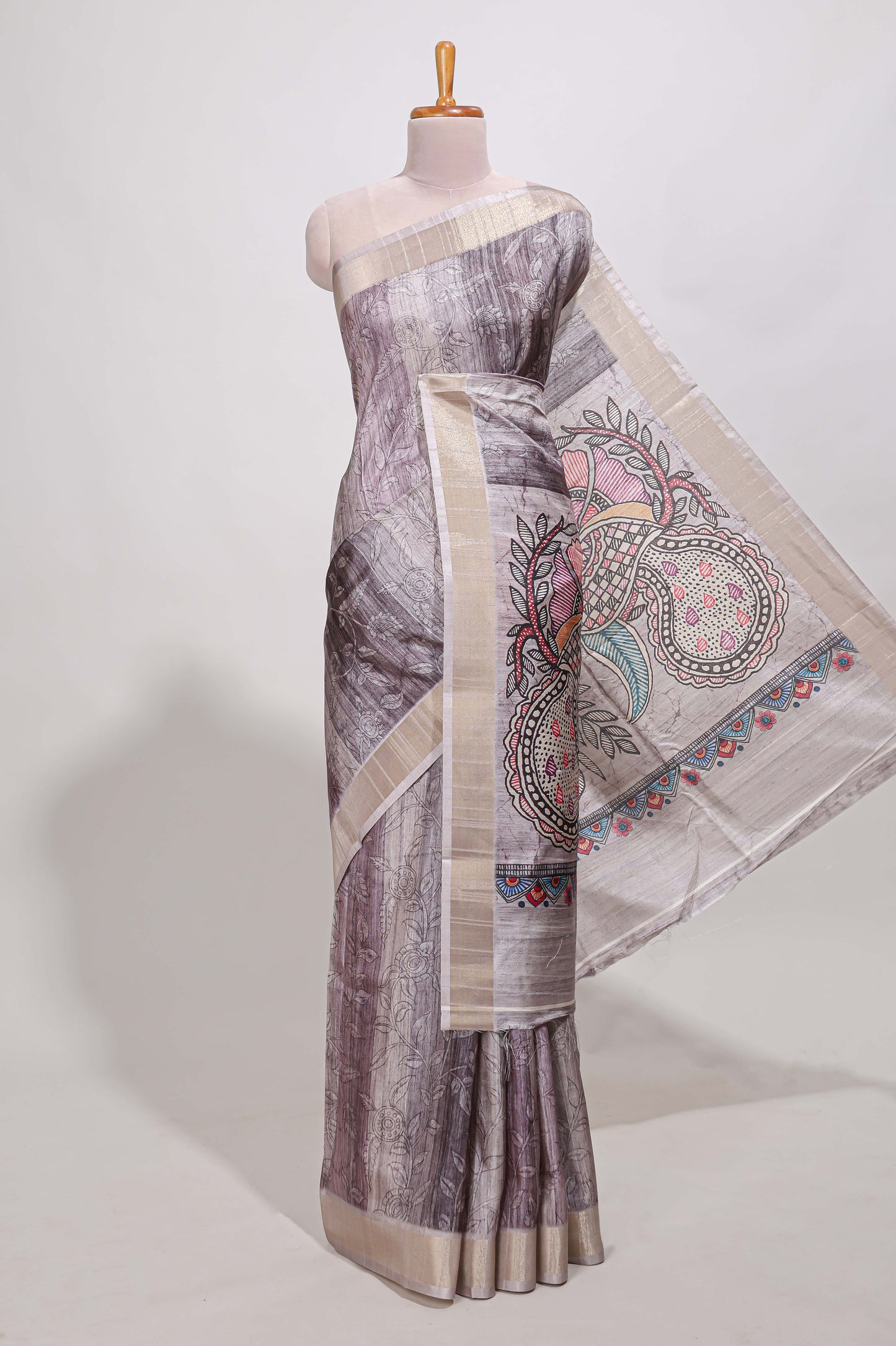Multi colour kalamakri tussar saree body with floral creeper prints zari border and kalamkari peacock motif print pallu