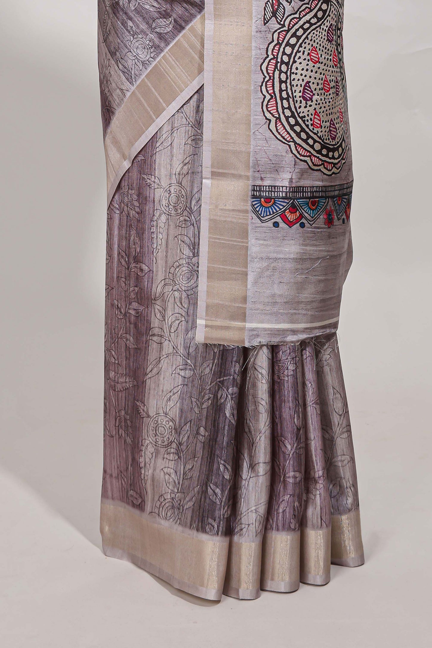 Multi colour kalamakri tussar saree body with floral creeper prints zari border and kalamkari peacock motif print pallu
