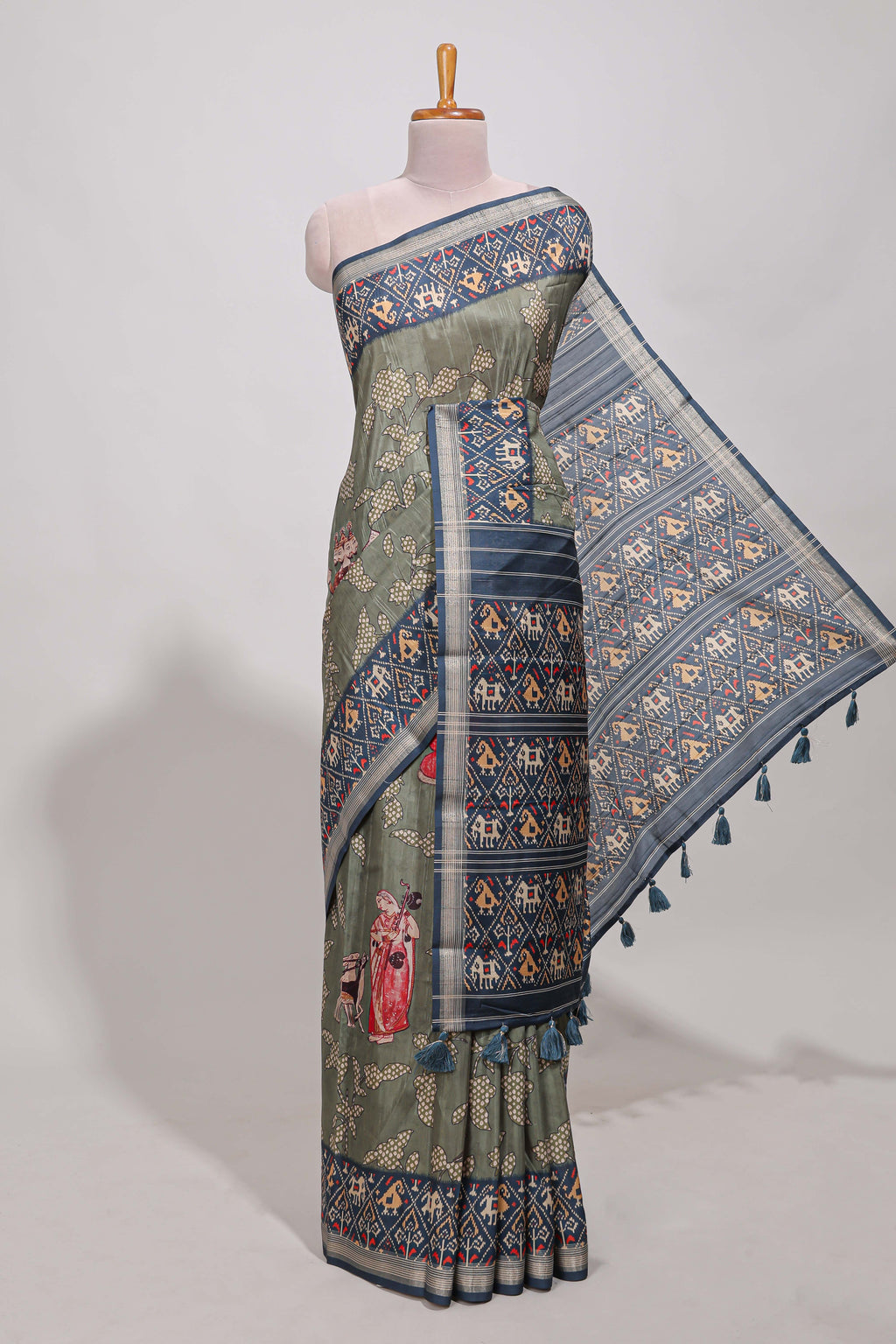 Olive green patola and pichwai tussar saree zari border  geomatric  matching pallu along with tussels