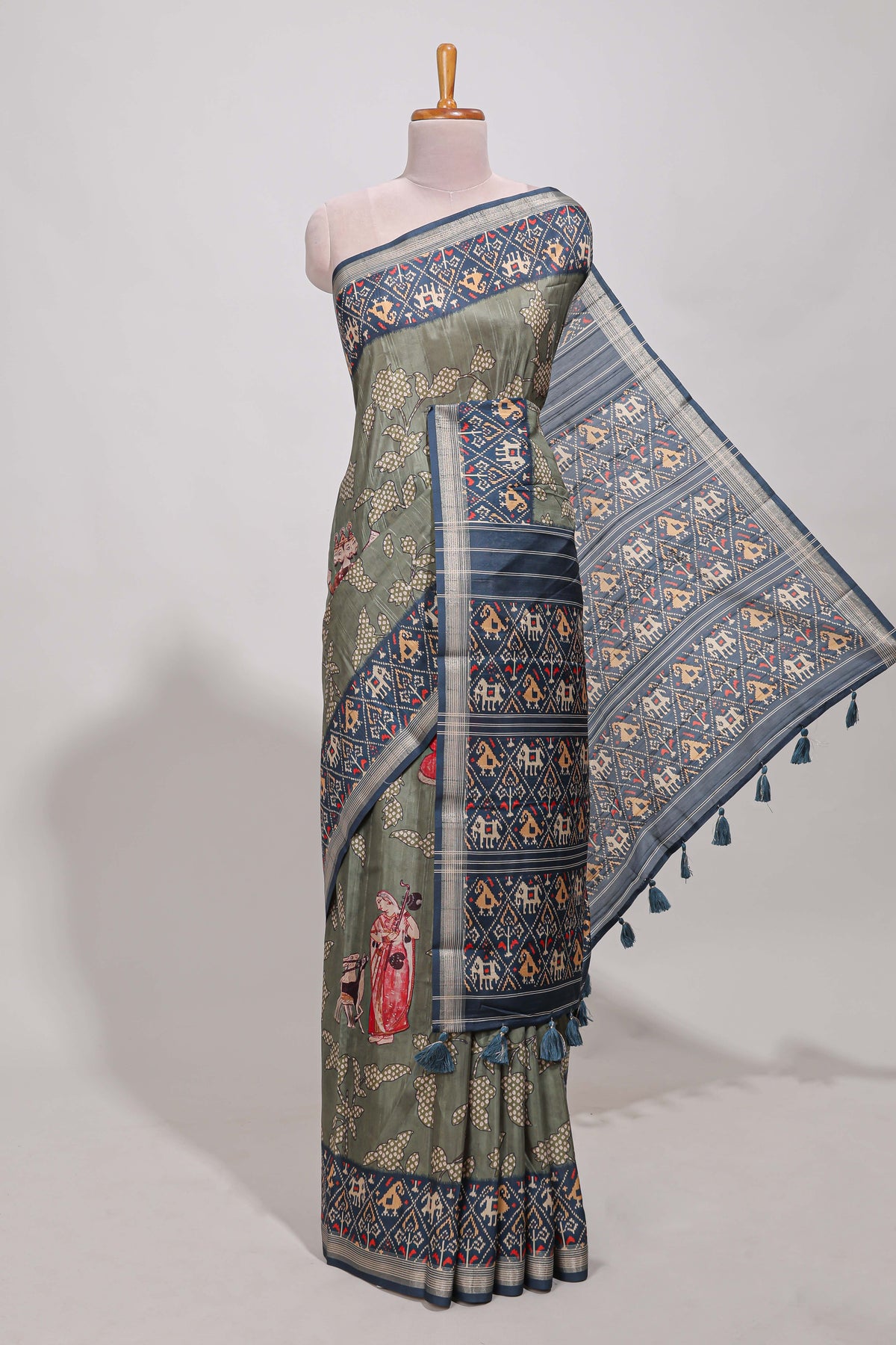 Olive green patola and pichwai tussar saree zari border  geomatric  matching pallu along with tussels