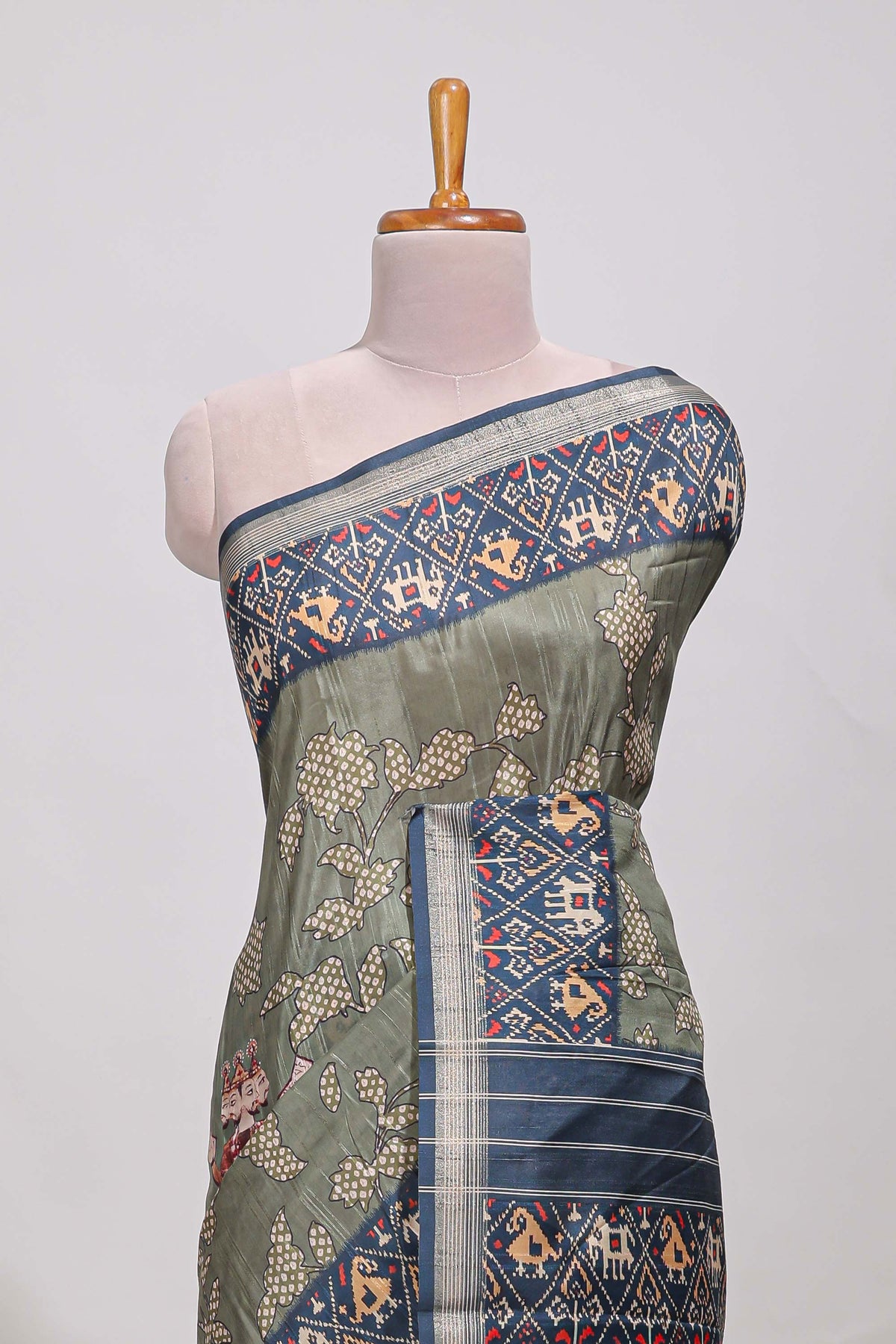 Olive green patola and pichwai tussar saree zari border  geomatric  matching pallu along with tussels