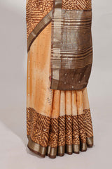 Orange geomatric tussar saree contrasting brown border with geomatric patterns ,and matching pallu with zari stripes blouse